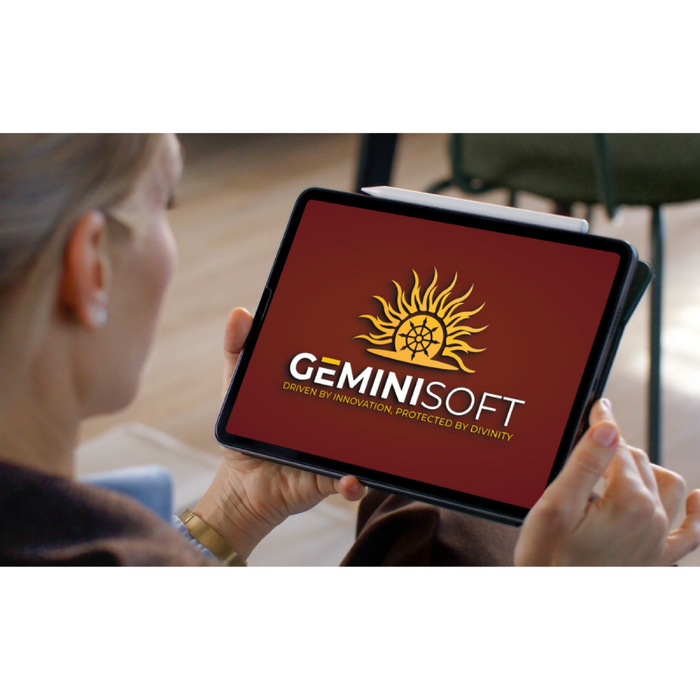 A user viewing the GeminiSoft brand on a tablet